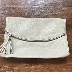 Express Cream Clutch with Tassel and Flap Closure